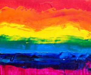 Colorful abstract acrylic painting with rainbow theme on canvas.